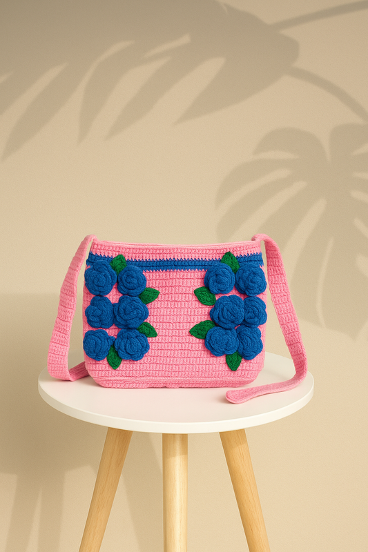 Pink crochet bag with blue flowers